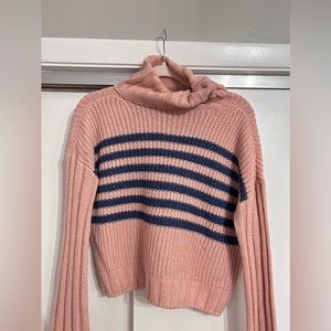 Pink and navy loose turtleneck sweater